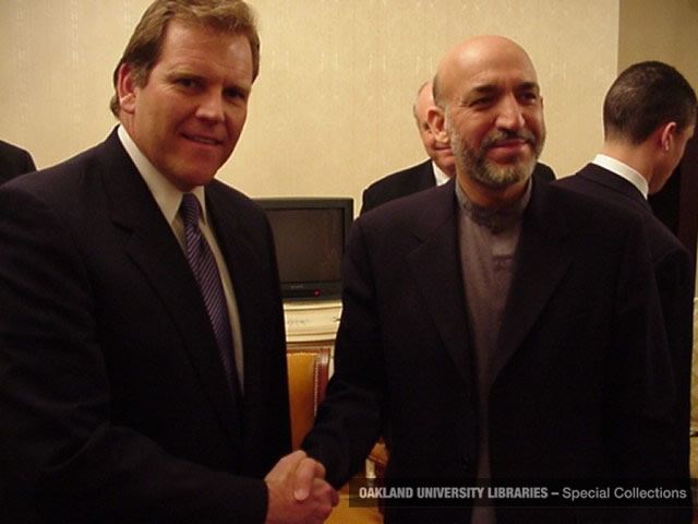 Rogers meeting Afghani president Hamid Karzai in Afghanistan on a fact-finding mission (2002)
